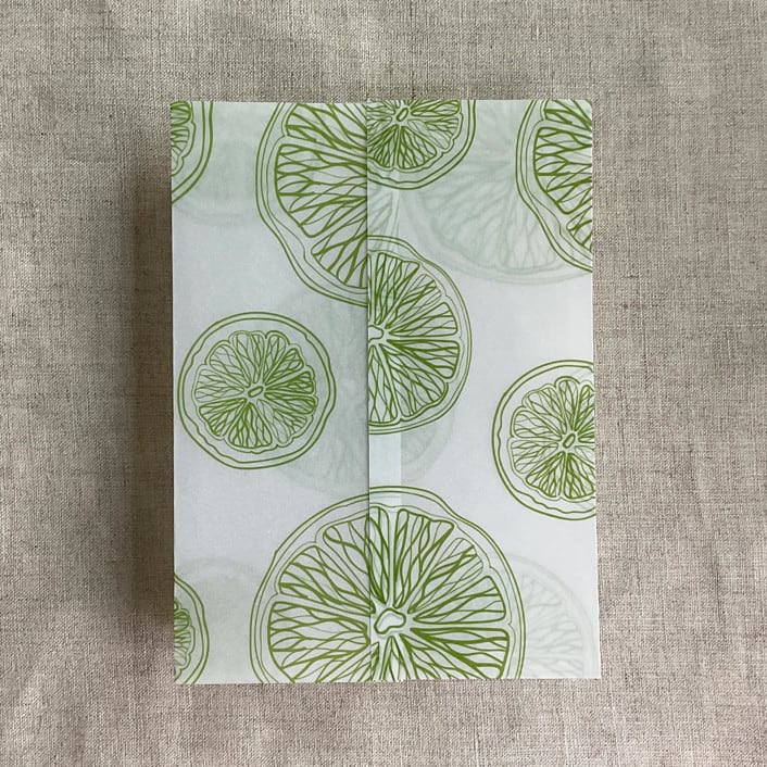 "Lime citrus celebration printed vellum wraps for 5x7 card | pack of 10" - Invitation Jackets and Overlays in green by Ivory Invitations