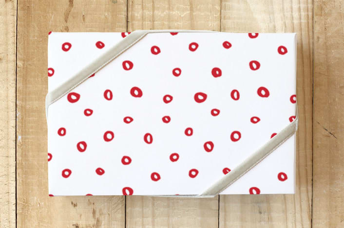 "Scattered dots" - Wrapping Paper in Holly Berry by Stacey Meacham - Front