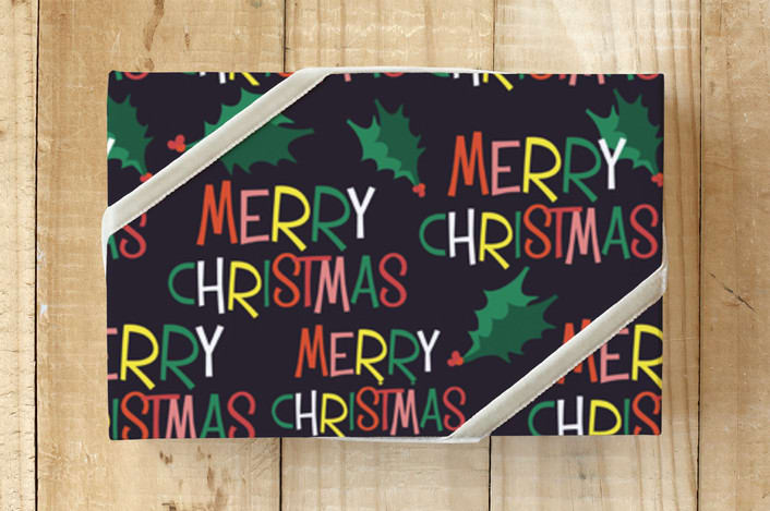"Holly Jolly Merry Christmas" - Wrapping Paper in Midnight Black by Erika Firm - Front