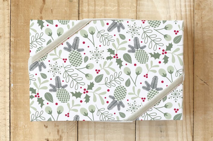 "Pinecones & Holly" - Wrapping Paper in Holly Green by Cavell Ferguson - Front