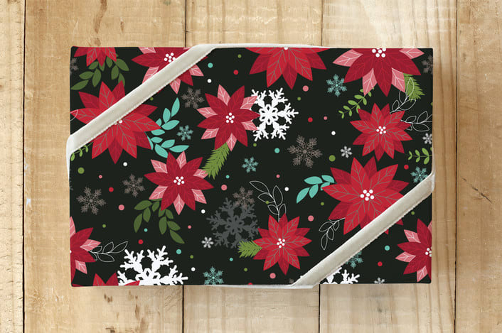 "Modern Poinsettia" - Wrapping Paper in Black by Angela Rekucki - Front