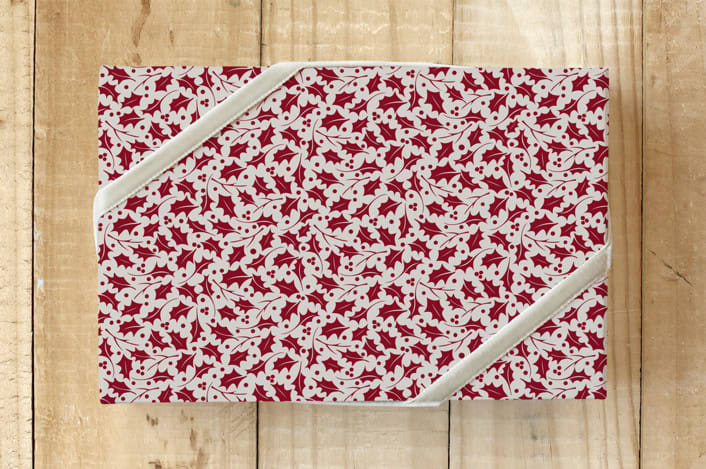 "Christmas Morning Holly" - Wrapping Paper in Creamy by Cavell Ferguson - Front