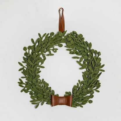 Small green felt Christmas wreath with leather ribbon
