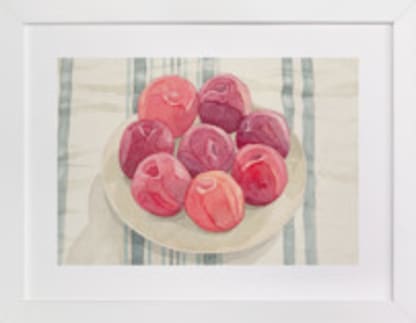 red plums on linen tablecloth
