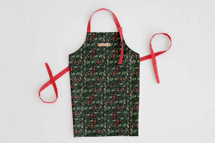 "Holly Branches" - Apron in Holly by Kristen Smith - Personalizable Apron
