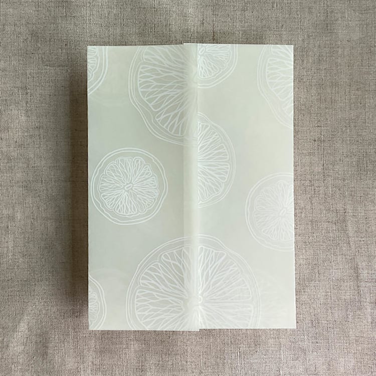 "Ivory citrus celebration white ink printed vellum wraps for 5x7 card | pack of 10" - Invitation Jackets and Overlays in natural by Ivory Invitations