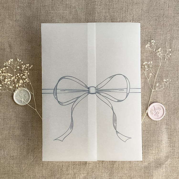 "Steel blue ribbon bow printed vellum wrap for 5x7 card | pack of 10" - Invitation Jackets and Overlays in blue by Ivory Invitations