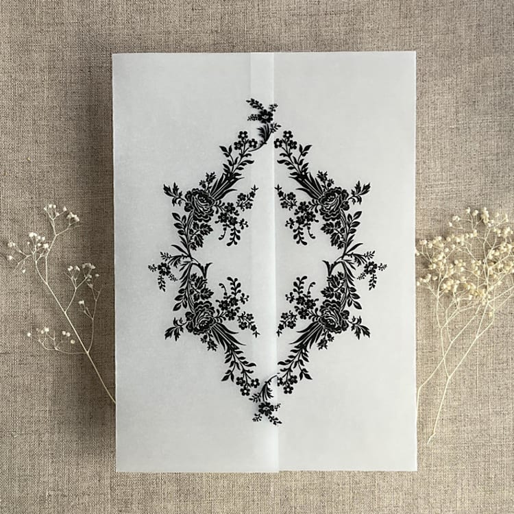 "Black print French floral crest vellum wrap for 5x7 card | pack of 10" - Invitation Jackets and Overlays in black by Ivory Invitations