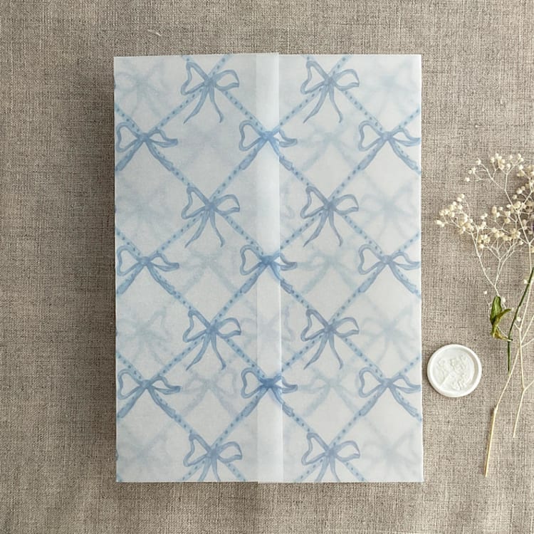 "Festive ribbon bow lattice sky blue printed vellum wrap for 5x7 card | pack of 10" - Invitation Jackets and Overlays in blue by Ivory Invitations