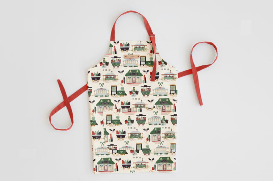 "Jolly Train" - Apron in Mistletoe by Beth Schneider - Personalizable Apron