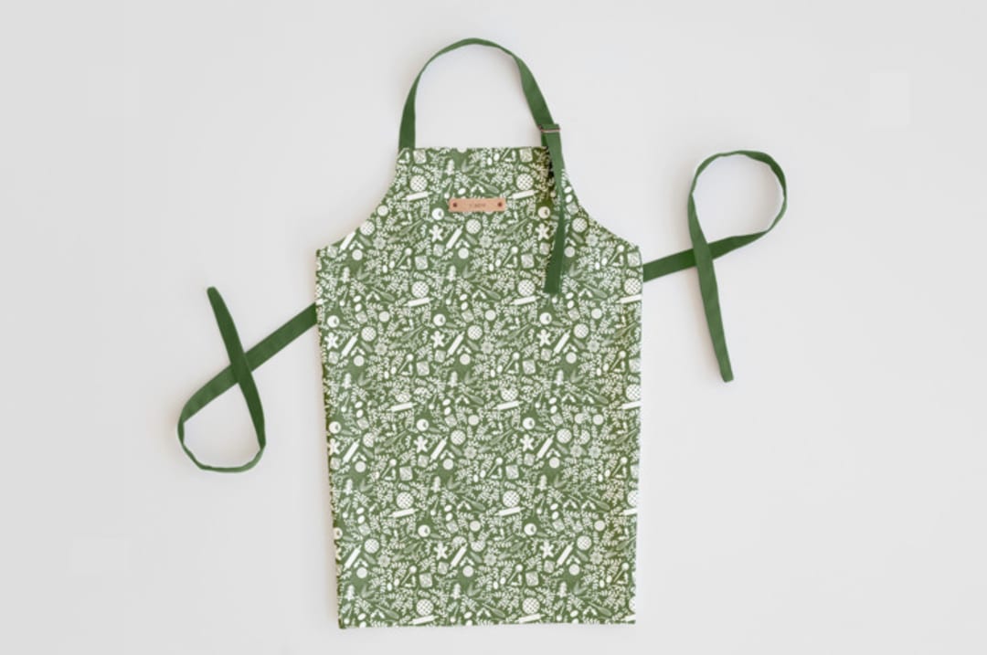 "A Baker's Holiday" - Apron in Sage by Jaclyn Ruble - Personalizable Apron