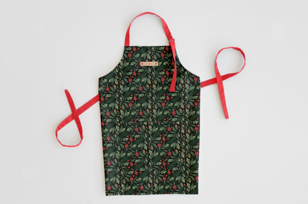 "Holly Branches" - Apron in Holly by Kristen Smith - Personalizable Apron