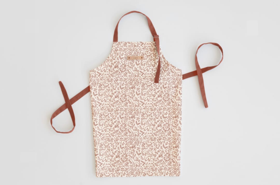 "Enchanted Holiday" - Apron in Cinnamon by Teju Reval - Personalizable Apron