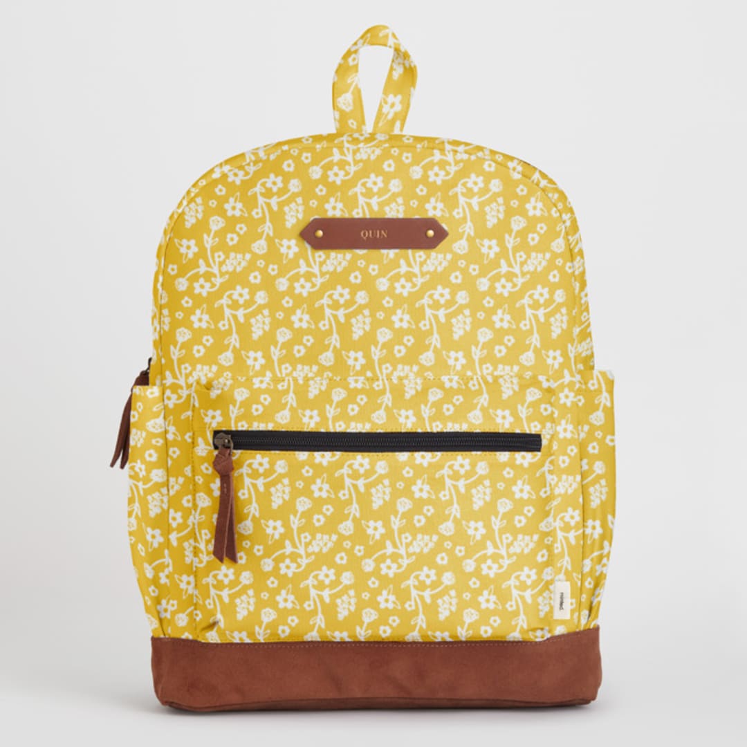 "Sunny Floral" - Backpack in Sunshine by Adrienne Davis - Front with Optional Personalization