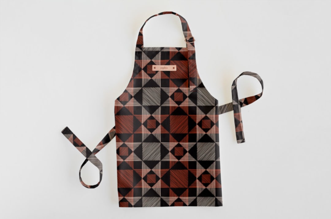 "Sketched Quilt" - Personalizable Children's Apron in Rust by Alethea and Ruth - Personalizable Apron