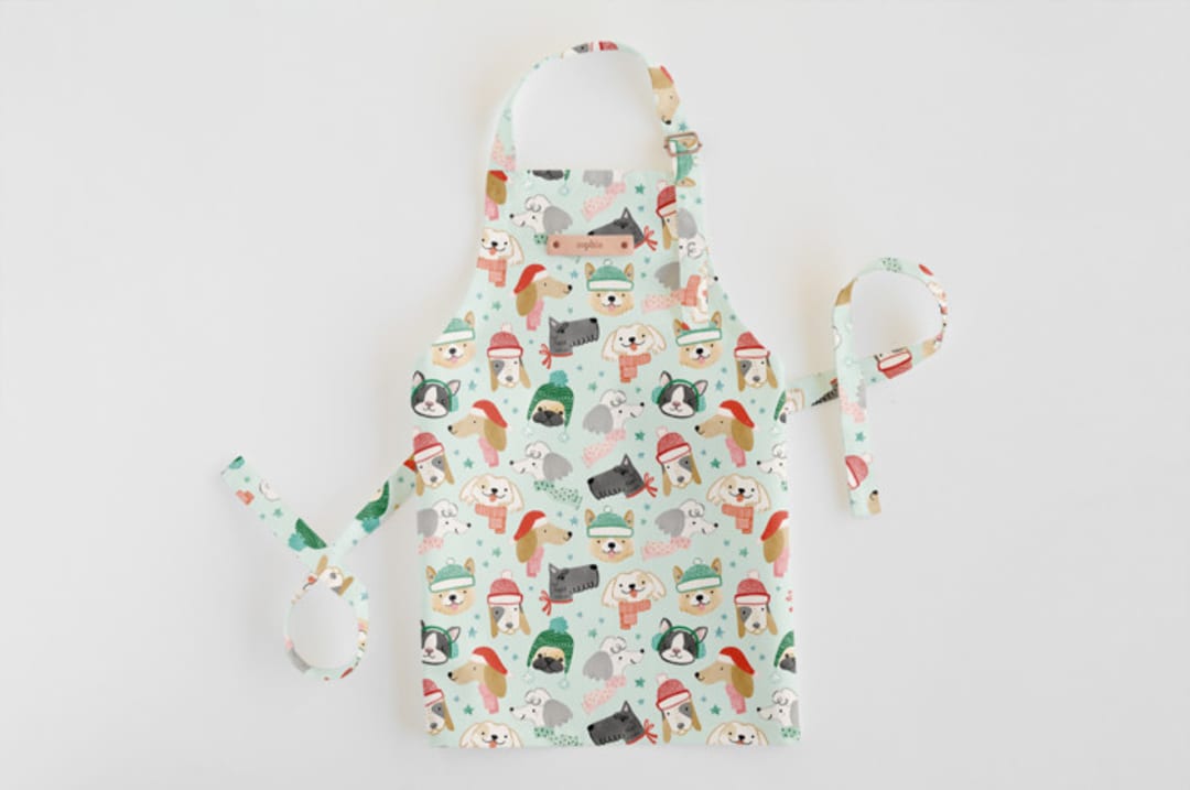 "Christmas Puppies" - Personalizable Children's Apron in Mint by Monika Torun - Personalizable Apron