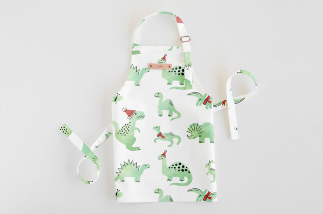 "Darling Dinos" - Personalizable Children's Apron in Mint by Jessie Steury - Personalizable Apron