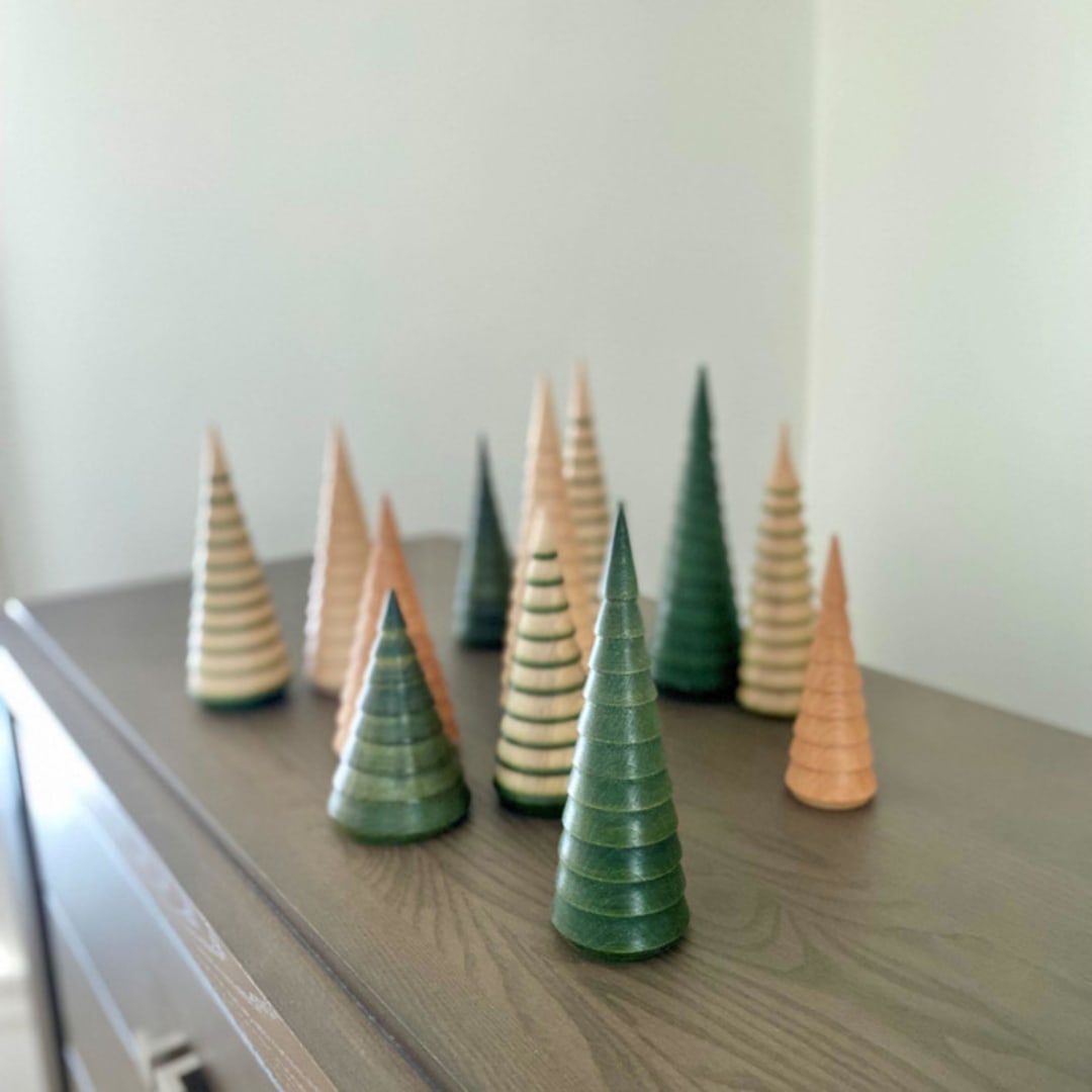 "The Fir Forest- 12 unique trees in four heights with three finishes" - Decorative Object in green by Ann Nygard