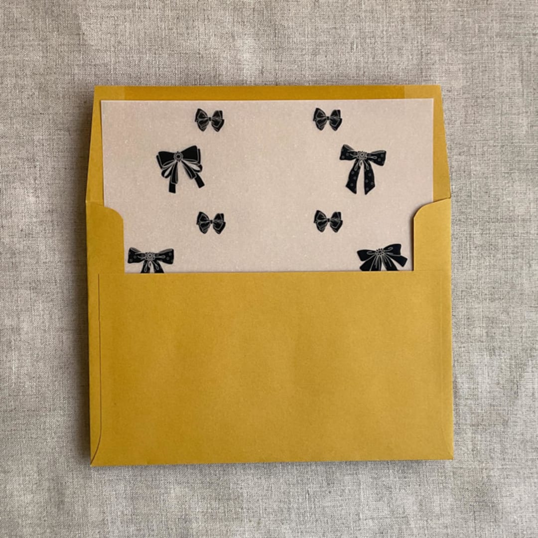 "Black ribbon bow printed vellum liner for A7 square flap envelope | pack of 10" - Envelope Liners in black by Ivory Invitations