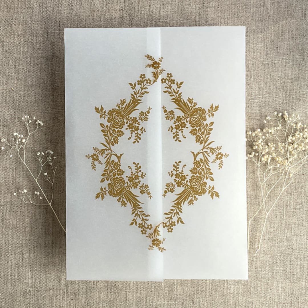 "Gold print French floral crest vellum wrap for 5x7 card | pack of 10" - Invitation Jackets and Overlays in gold by Ivory Invitations