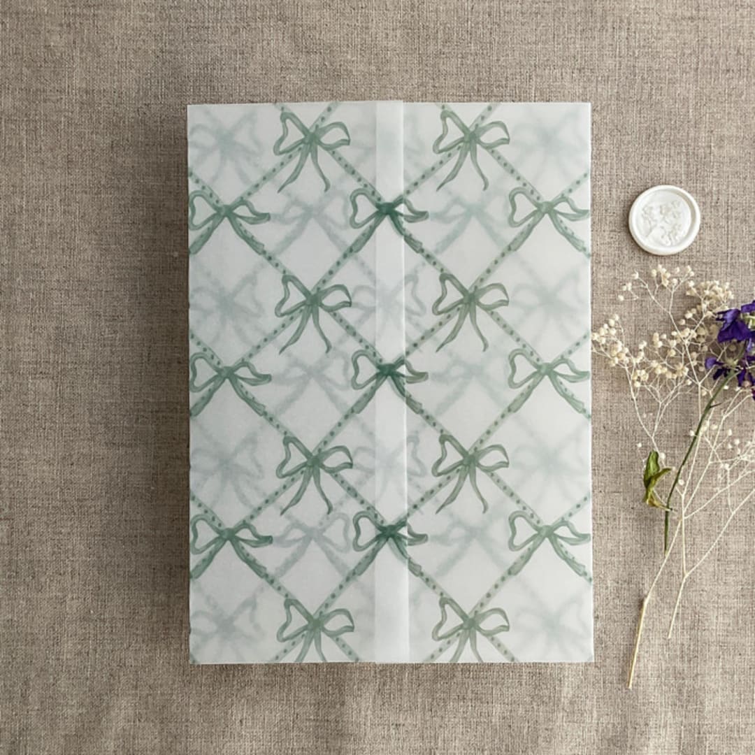 "Festive ribbon bow lattice sage printed vellum wrap for 5x7 card | pack of 10" - Invitation Jackets and Overlays in green by Ivory Invitations