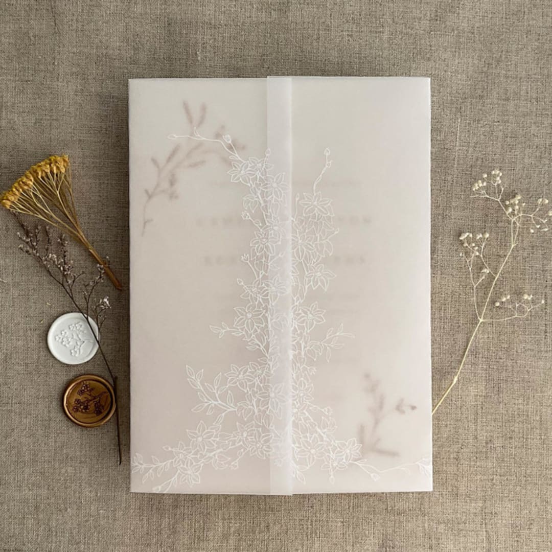 "White ink print Marianne's bouquet floral printed vellum wrap for 5x7 card  | pack of 10" - Invitation Jackets and Overlays in white by Ivory Invitations