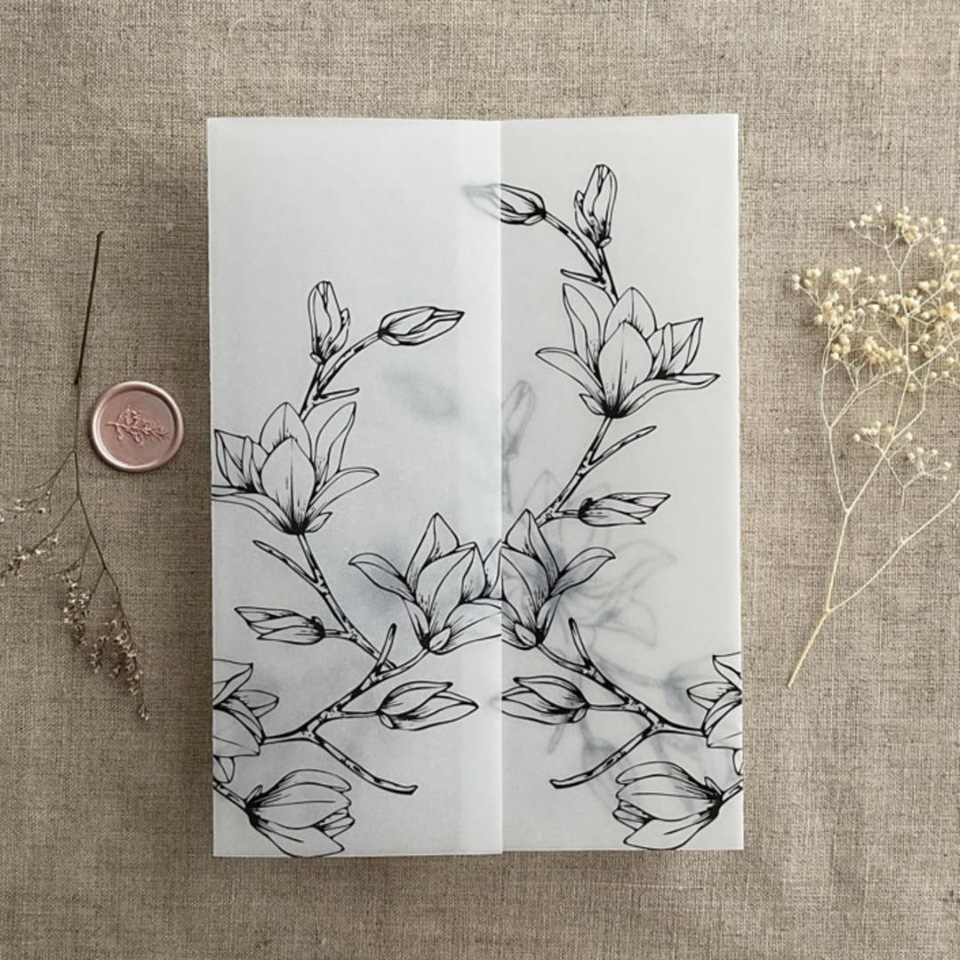 "Black Magnolia flowers printed vellum wrap for 5x7 card  | pack of 10" - Invitation Jackets and Overlays in black by Ivory Invitations