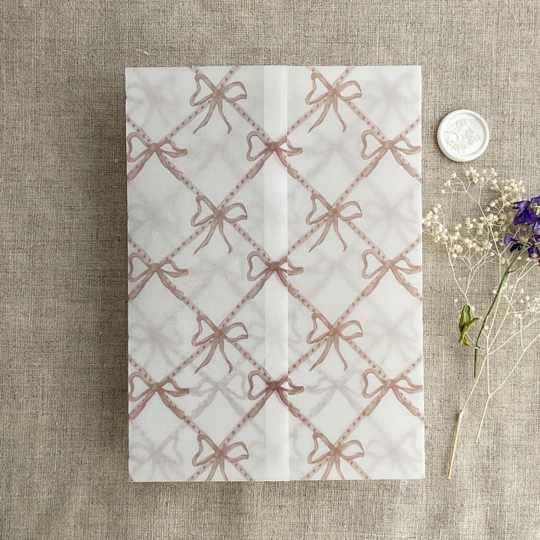 "Festive ribbon bow lattice rosy pink printed vellum wrap for 5x7 card | pack of 10" - Invitation Jackets and Overlays in pink by Ivory Invitations