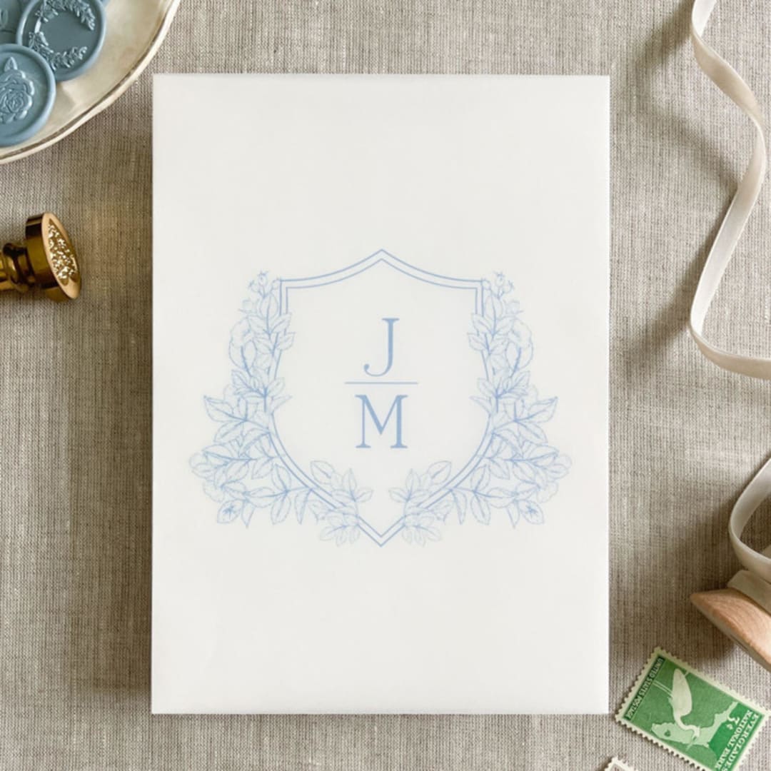 "Custom dusty blue crest and initials vellum wrap for invitations | Set of 10" - Invitation Jackets and Overlays in blue by Maria Ferrer G.