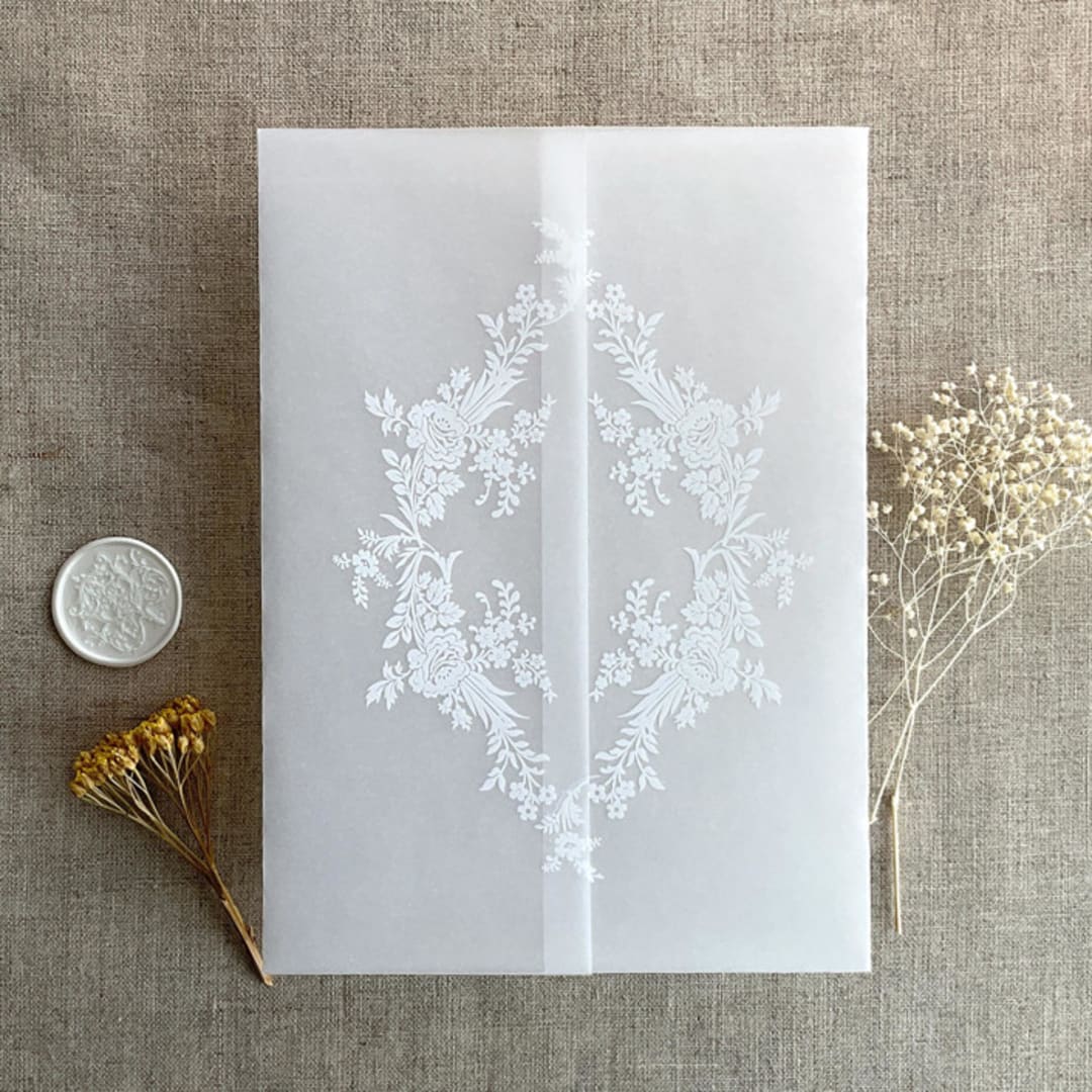 "White ink print french floral crest vellum wrap for 5x7 card | pack of 10" - Invitation Jackets and Overlays in white by Ivory Invitations