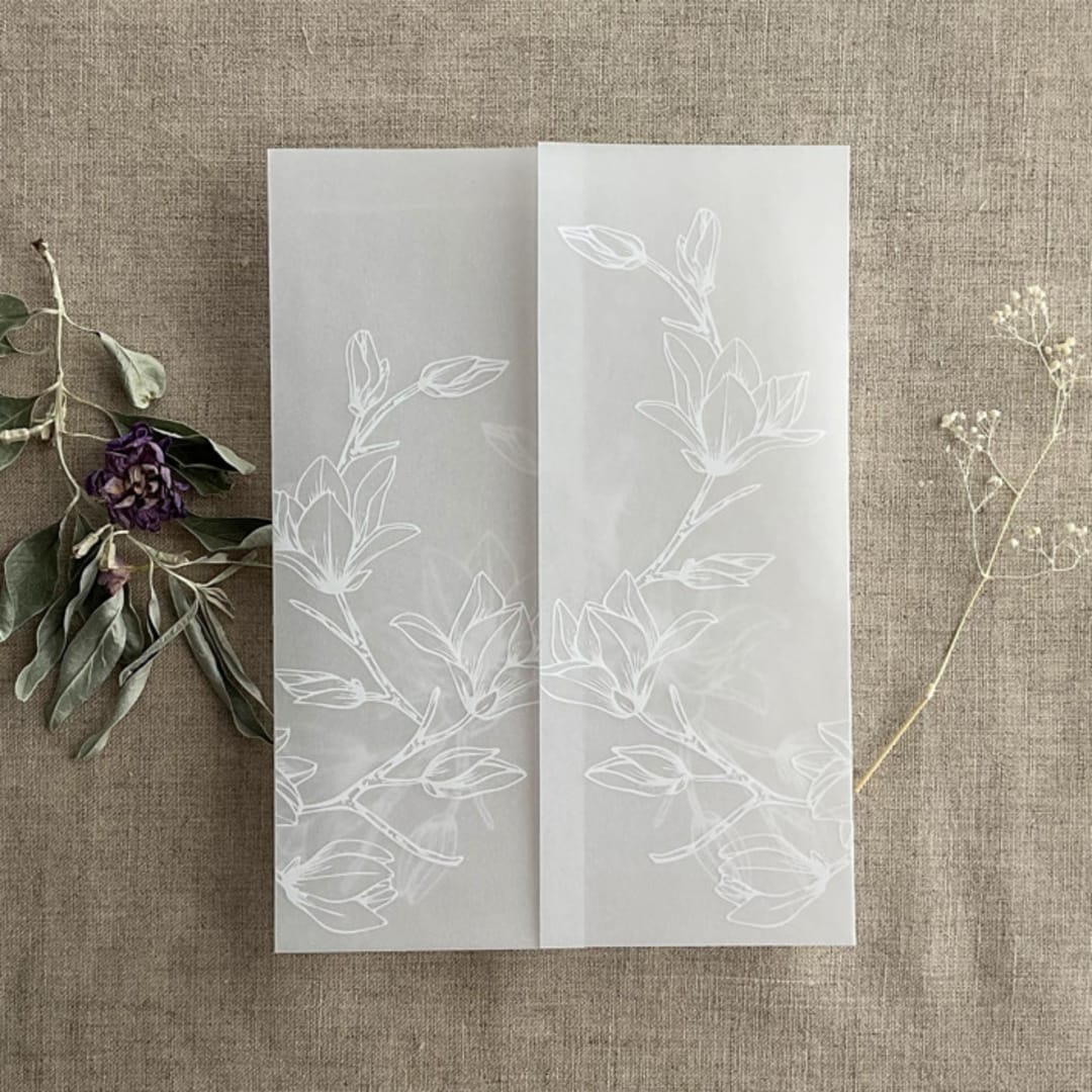 "White ink print Magnolia flowers vellum wrap for 5x7 card | pack of 10" - Invitation Jackets and Overlays in white by Ivory Invitations