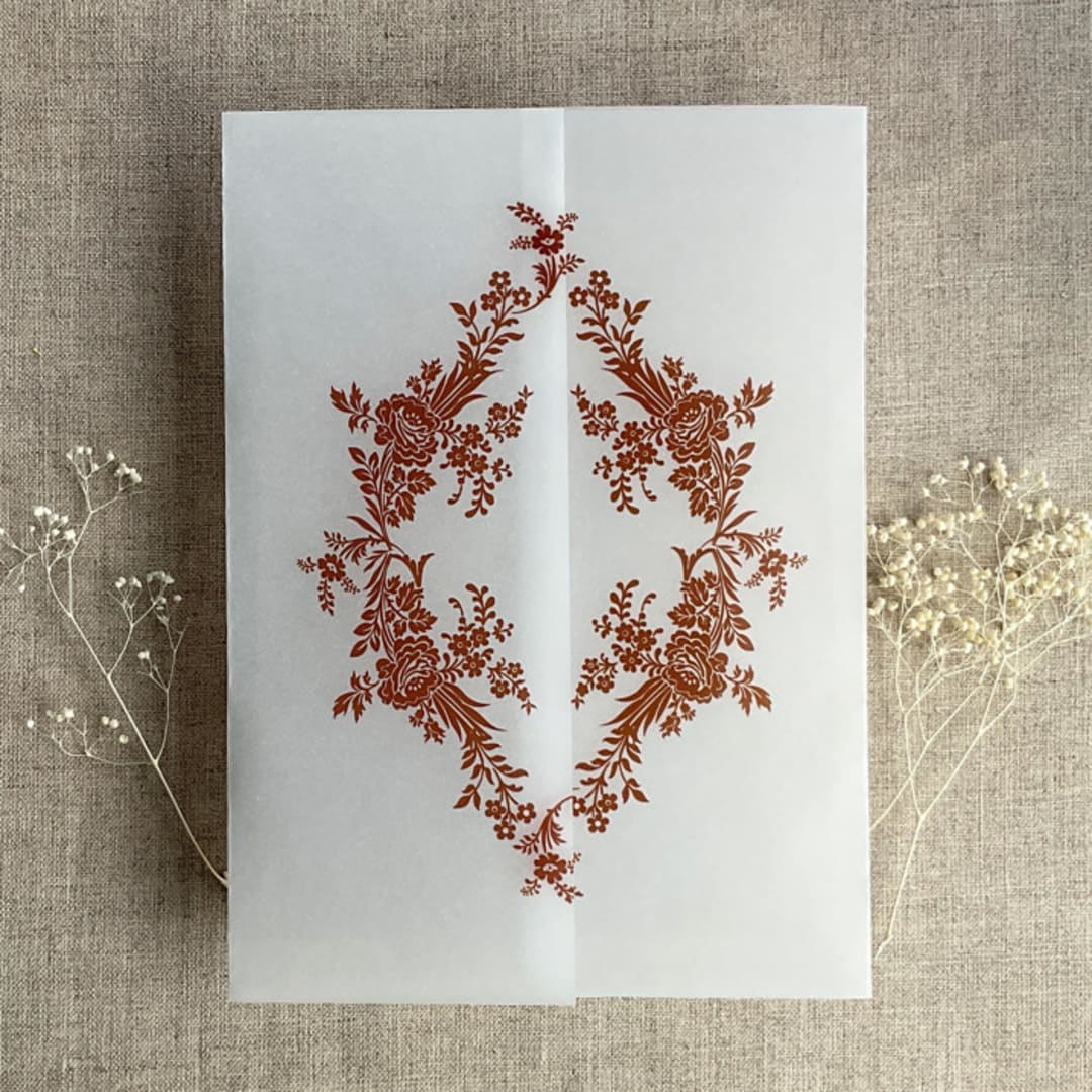 "Rust print French floral crest vellum wrap for 5x7 card | pack of 10" - Invitation Jackets and Overlays in copper by Ivory Invitations