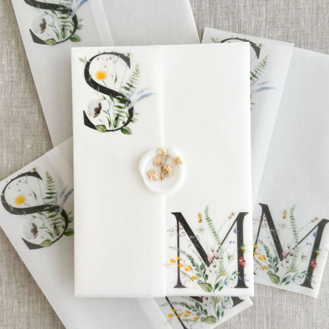 "Couple's initials with wildflowers vellum wraps for 5x7 invitations | Set of 10" - Invitation Jackets and Overlays in multicolorassorted-colors by Maria Ferrer G.