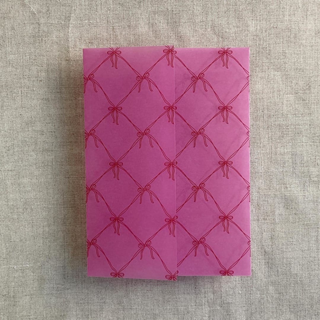 "Pink garnet bow colored vellum wrap for 5x7 card | pack of 10" - Invitation Jackets and Overlays in pink by Ivory Invitations