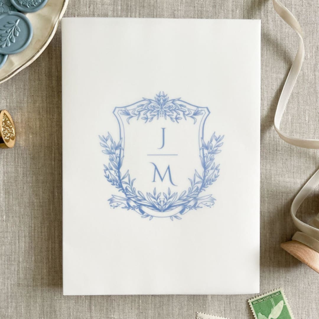 "Custom blue crest and initials vellum wrap for invitations | Set of 10" - Invitation Jackets and Overlays in blue by Maria Ferrer G.