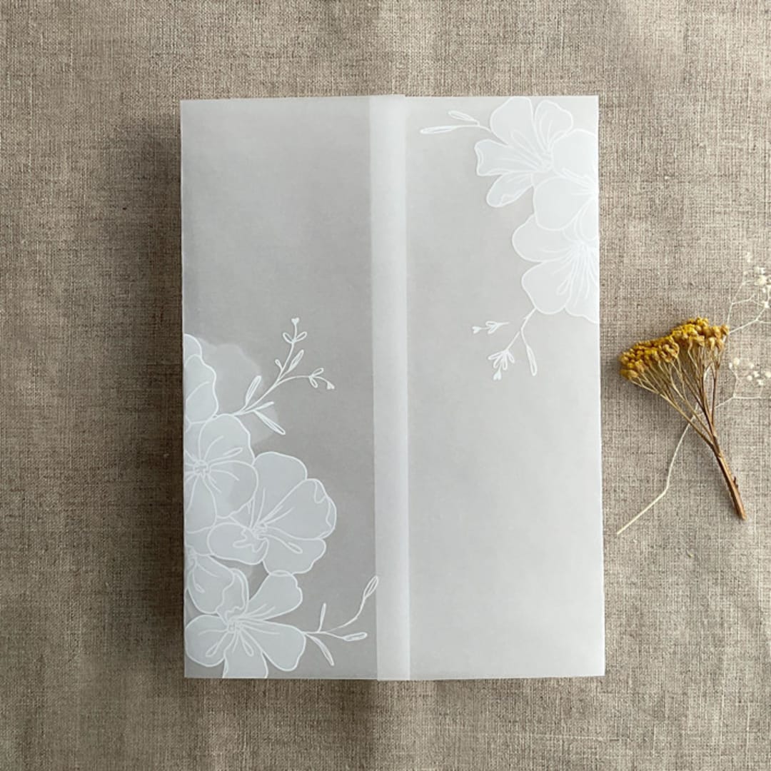 "Camelia floral white ink printed vellum wrap for 5x7 card | pack of 10" - Invitation Jackets and Overlays in white by Ivory Invitations