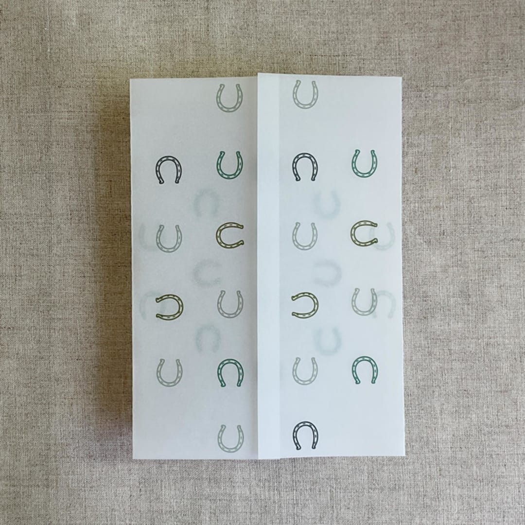 "Green horseshoes vellum wrap for 5x7 card | pack of 10" - Invitation Jackets and Overlays in green by Ivory Invitations