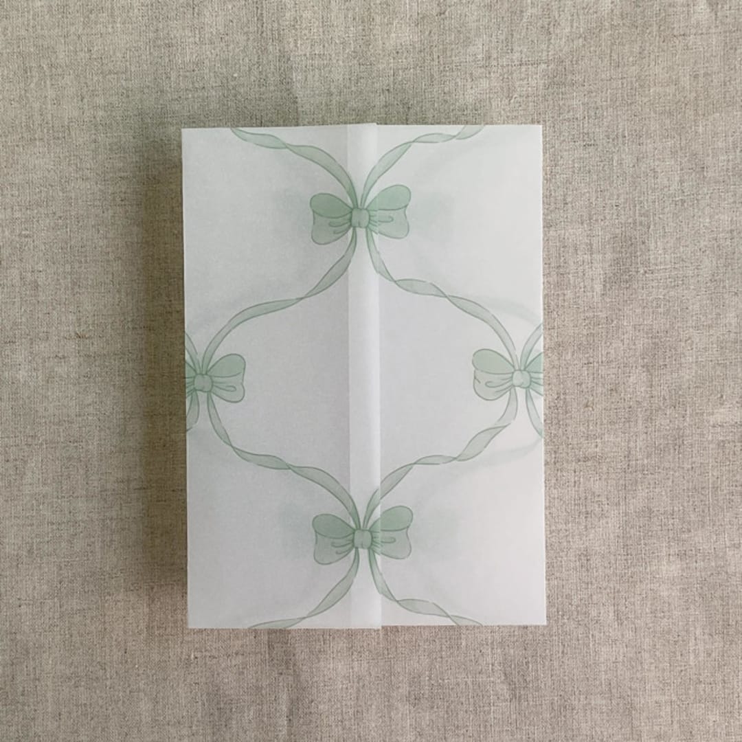 "Green genie floral bows printed vellum wrap for 5x7 card | pack of 10" - Invitation Jackets and Overlays in green by Ivory Invitations