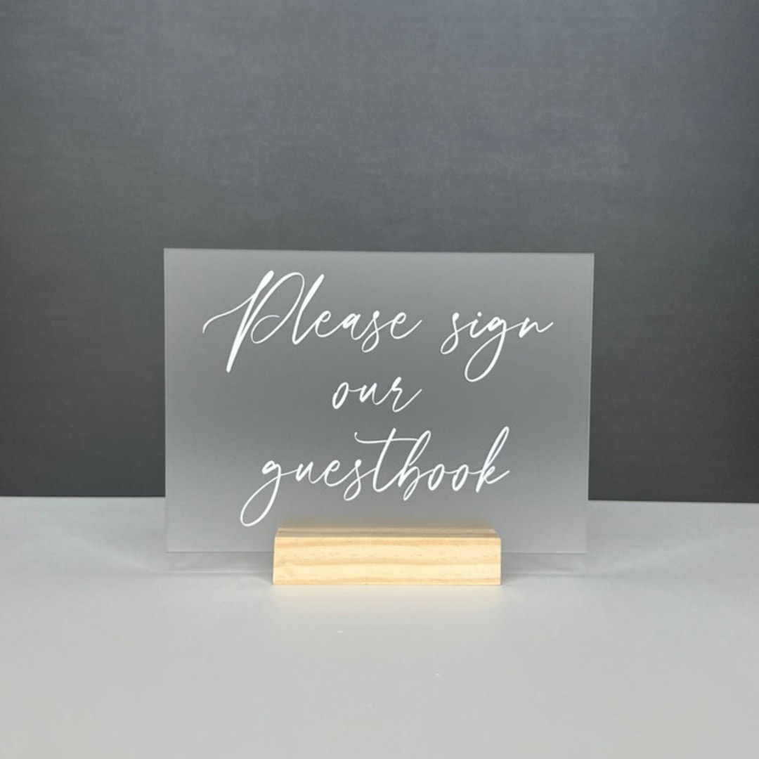Frosted Acrylic Please Sign Our Guestbook Sign, White Lettering And Natural Wood Base