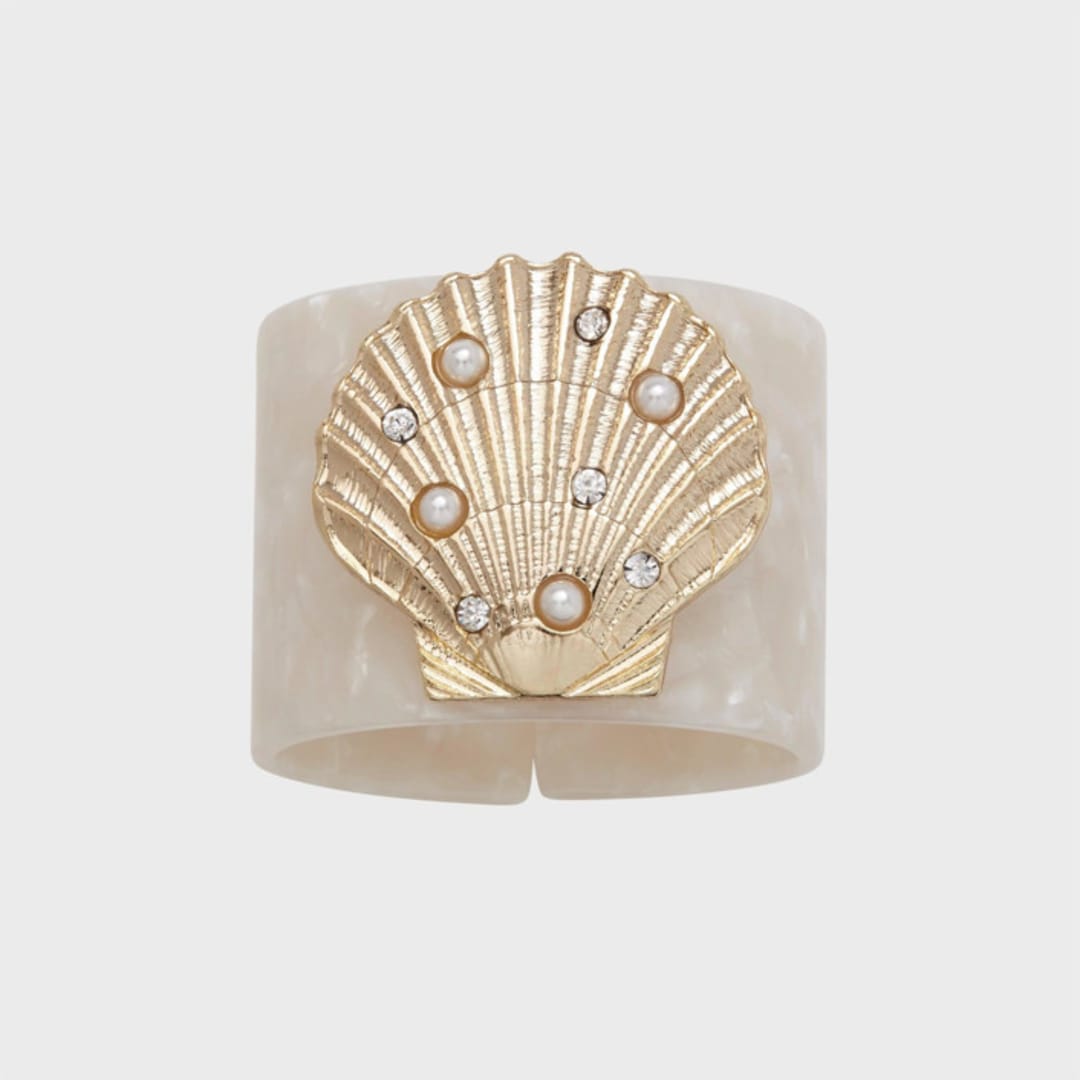 "Shell resin napkin rings, pearly white, set of four" - Tabletop Accessories in white by Joanna Buchanan