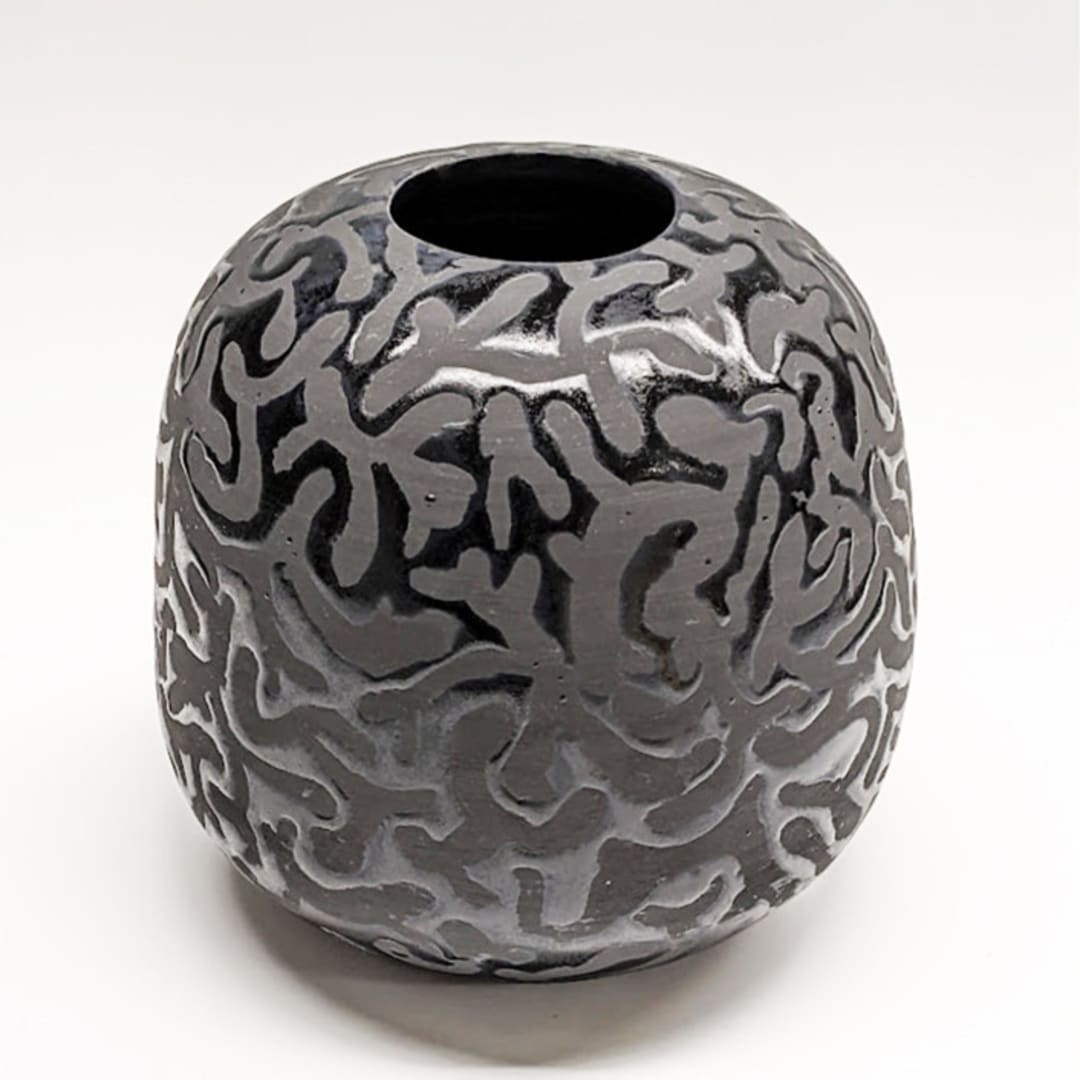 Round black vase with mushroom pattern