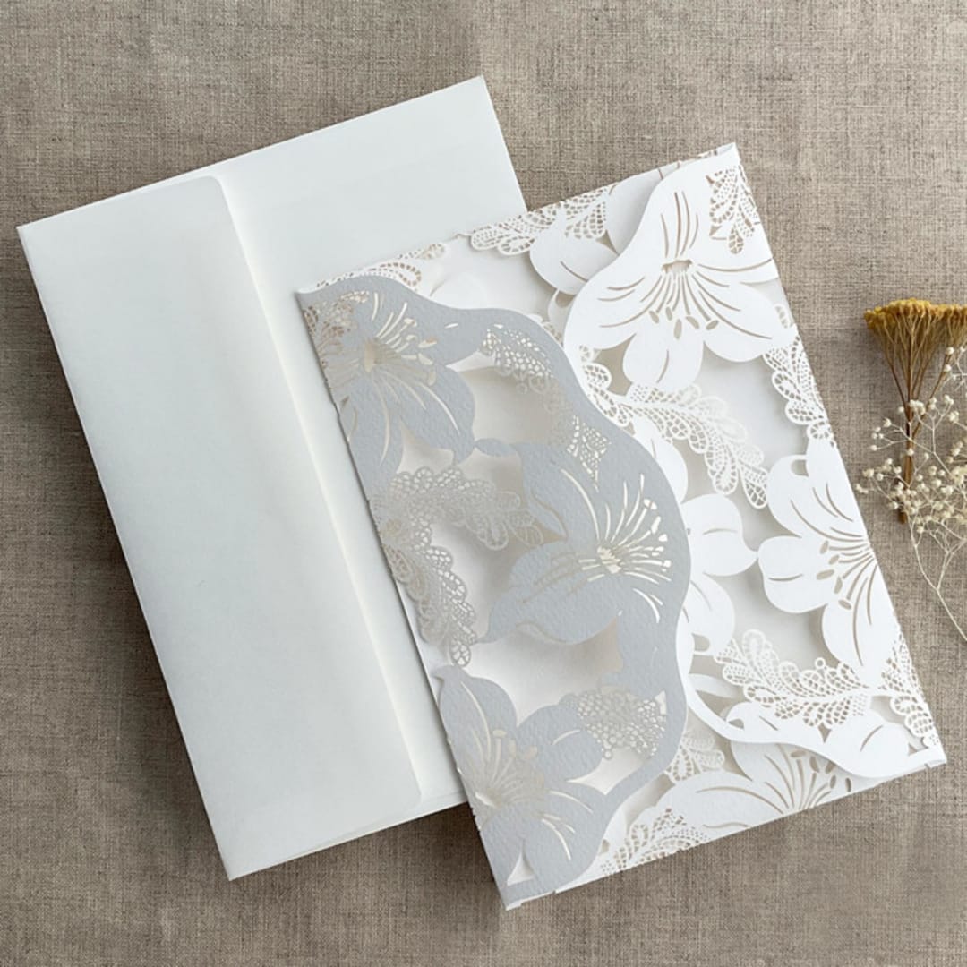 "White Lily Floral Lasercut Pocket for 5x7 inch Invitation | Pack of 10 | Envelopes Included" - Invitation Pockets in white by Ivory Invitations