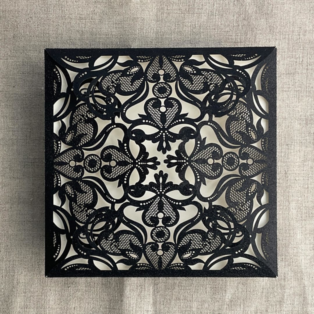"Black glitter lace laser cut square petal fold | pack of 10" - Invitation Pockets in black by Ivory Invitations