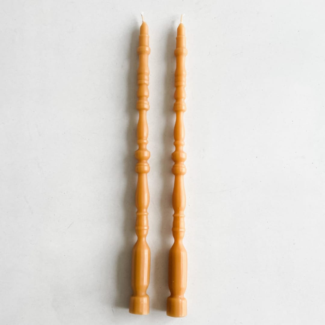 "SET OF 2 - SPINDLE LEG TAPERS // ORO" - Candles in yellow by borrowed BLU