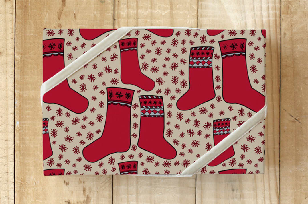 "Nordic Holiday Stockings " - Wrapping Paper in Scarlet by Lisa Travis - Front