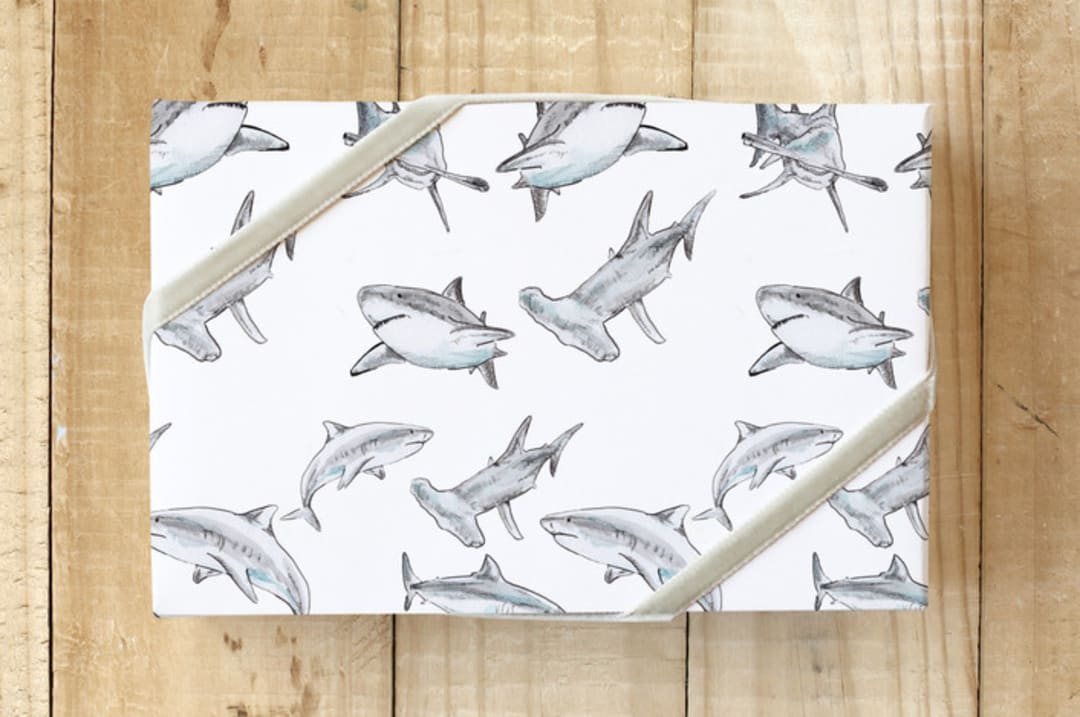 "Wrap every gift like it's shark week!" - Wrapping Paper in shark grey by Lauren Rogoff - Front