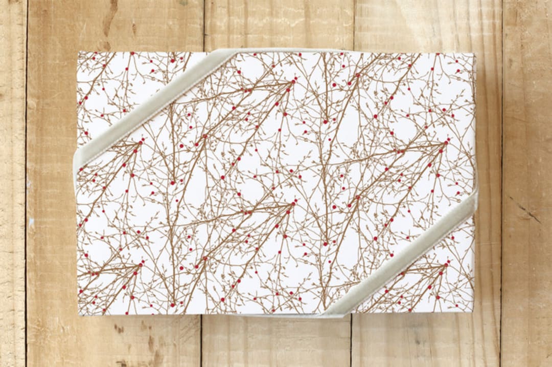 "Christmas Branches and Berries" - Wrapping Paper in Goldish Beige by Simi Gauba - Front