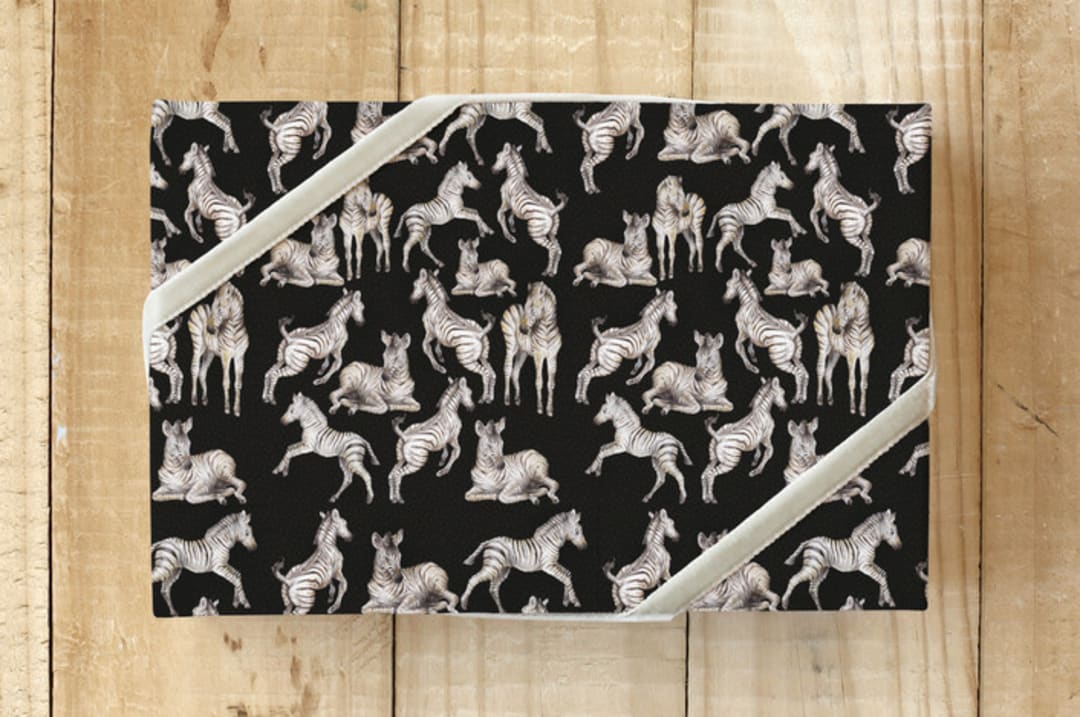 "A Dazzle of Zebras- black" - Wrapping Paper in Black by Lauren Rogoff - Front