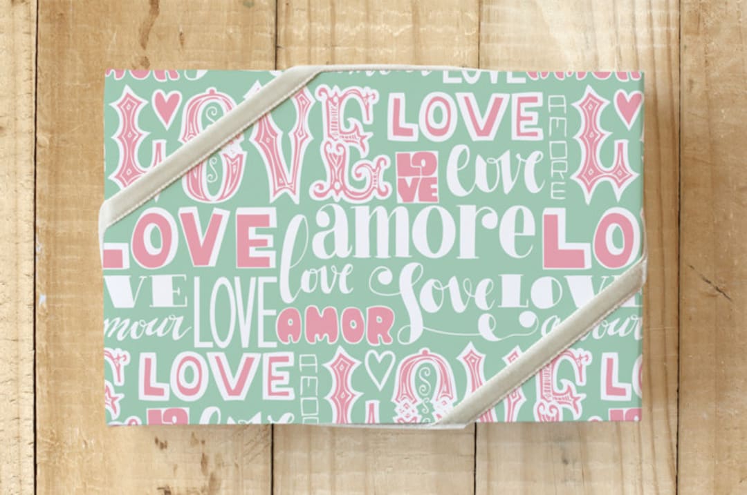"Love Amor Amore" - Wrapping Paper in Green by Luz Alliati - Front