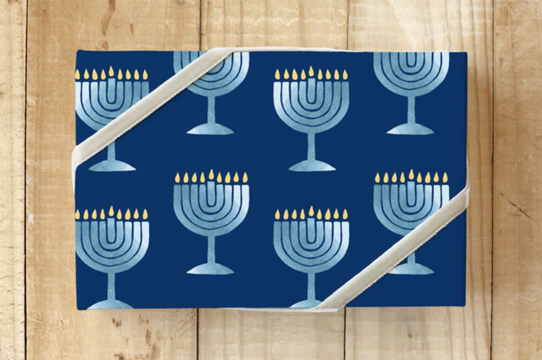 "Glimmering Menorah" - Wrapping Paper in navy by Lisa Travis - Front